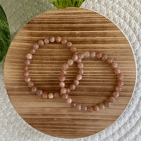 Perzik Maansteen kogelarmband 6mm dames