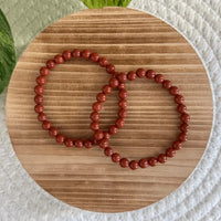 Rode Jaspis kogelarmband 6mm dames